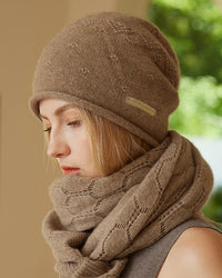 Rolled-edge cashmere beanie with subtle raised knit details, softly finished rolled opening and relaxed slouchy crown, a warm solid fall-winter hat for everyday cold-weather wear.