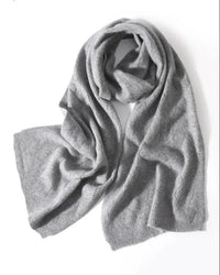 Diamond openwork creates a graceful surface, while the generous scarf shape makes layering feel natural. 