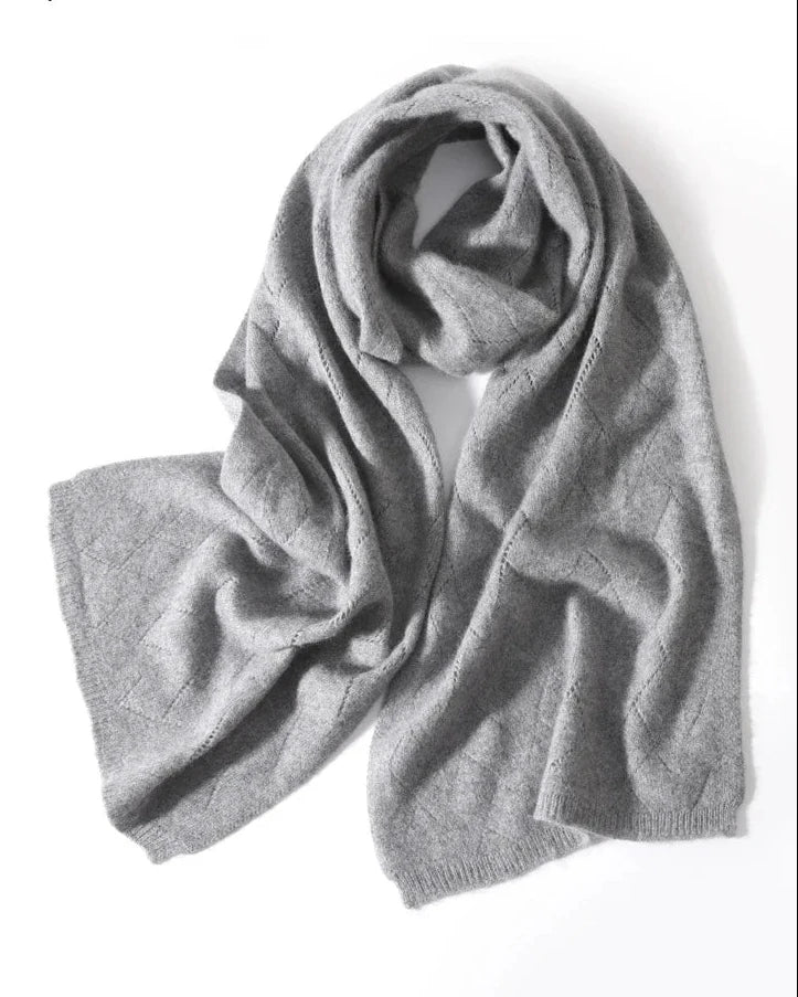 Diamond openwork creates a graceful surface, while the generous scarf shape makes layering feel natural. 