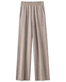 A pair of high-waist knit wide-leg pants featuring an elastic waist, side pockets, and a floor-length straight drape for an elegant, relaxed silhouette.