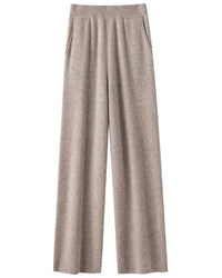 A pair of high-waist knit wide-leg pants featuring an elastic waist, side pockets, and a floor-length straight drape for an elegant, relaxed silhouette.