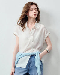 Women's Lyocell blend asymmetric waist-cinched shirt featuring a side-slit placket and rolled cuffs, crafted from lightweight fabric with beautiful drape for an effortlessly polished vacation look.