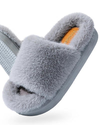 A pair of furry platform house slippers featuring a thick, soft upper and a lightweight EVA sole, designed for cozy comfort and a modern, elevated look.