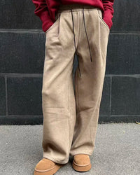 High-waist loose corduroy wide-leg trousers for women. Soft elastic waist, warm ribbed texture, and a flattering silhouette perfect for autumn and winter styling.