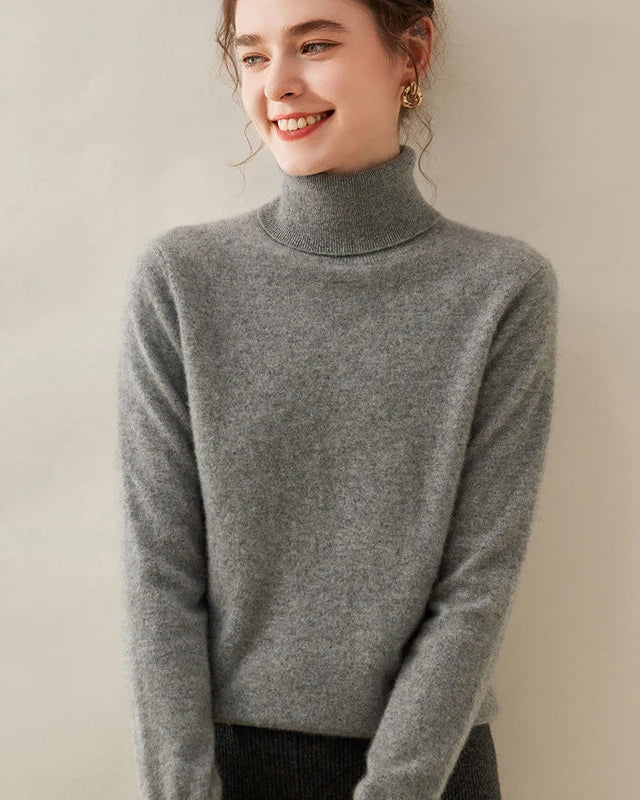Classic cashmere turtleneck sweater for women with ribbed fold-over neck, long sleeves, ribbed cuffs and hem, a soft 100% cashmere fall-winter pullover for everyday wear.