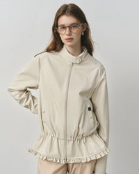 A turn down collar frames the neckline, the front zip keeps the look streamlined, and practical pockets add function without bulk.