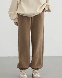 A pair of high-waist double-sided fleece pants with a straight-leg fit, designed for soft substantial warmth that layers easily from commute to weekend.