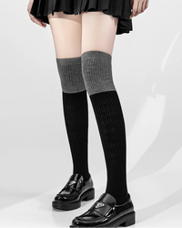 At knee height, these socks occupy a versatile position in the wardrobe — long enough to provide meaningful coverage, short enough to work with skirts, dresses, and trousers alike.