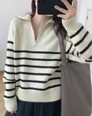 A striped cashmere half-zip sweater with wide turn-down collar, zipper opening and thick knit, designed for a cool-weather layering look that pairs from sneakers to boots.