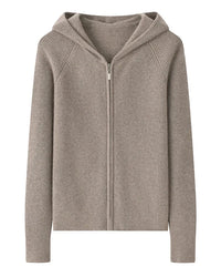 A 100% goat cashmere zip cardigan with a hood and softly padded shoulders, designed for lightweight warmth that layers easily over tees and dresses.