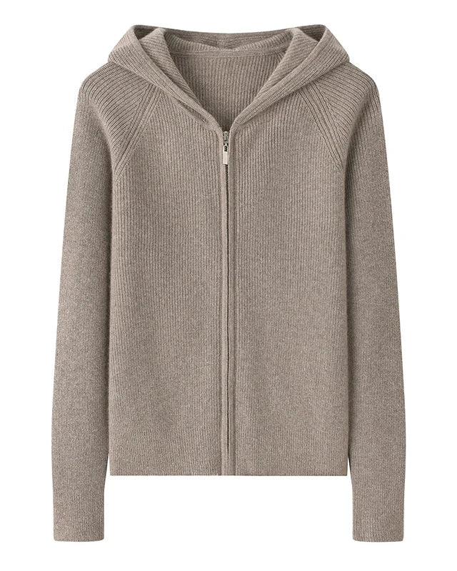 A 100% goat cashmere zip cardigan with a hood and softly padded shoulders, designed for lightweight warmth that layers easily over tees and dresses.