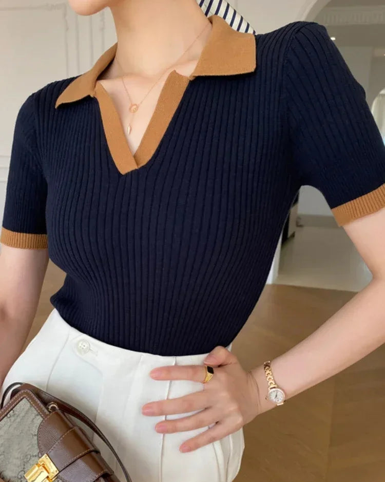 A slim, true-to-size fit flatters the figure naturally, while the soft knit fabric drapes with quiet sophistication.