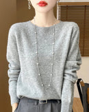 A pure merino wool pullover sweater with a clean O-neck and slim regular fit, designed for soft, versatile layering in autumn and winter.