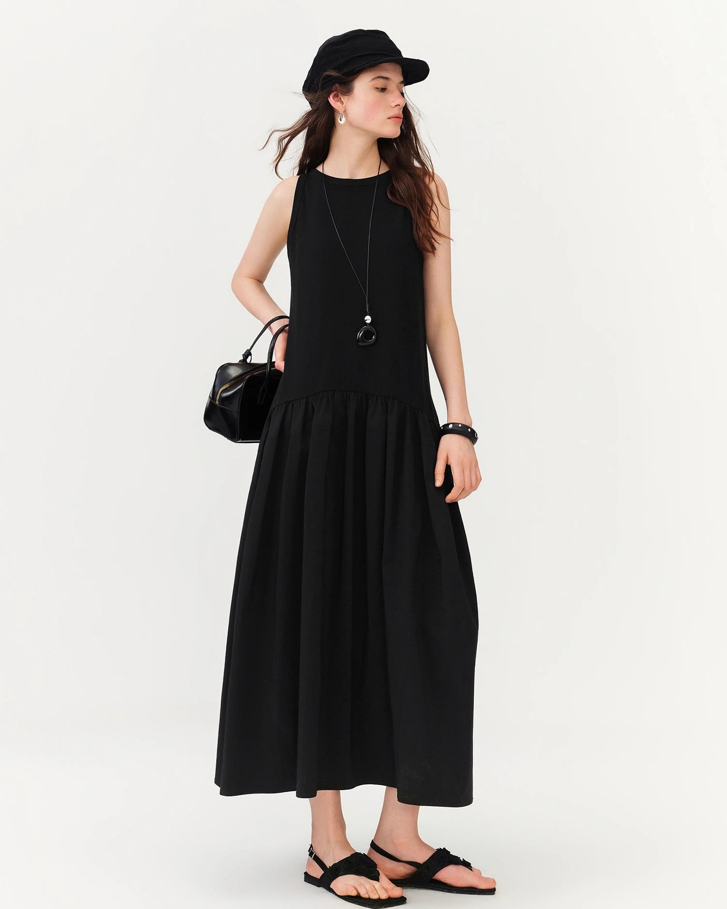 Sleeveless crew-neck ankle dress with A-line silhouette and slight stretch. Dual-fabric build for all-day comfort — minimalist style from commute to evening.