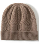 A cable-knit cashmere beanie with cable knit, fold-over ribbed cuff, light stretch, unisex design, designed for a cozy winter layering look that pairs from sneakers to boots.