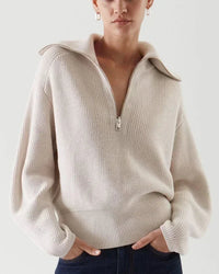 A relaxed fit allows for easy movement, while the turn-down collar and zipper detail keep the look intentional. 