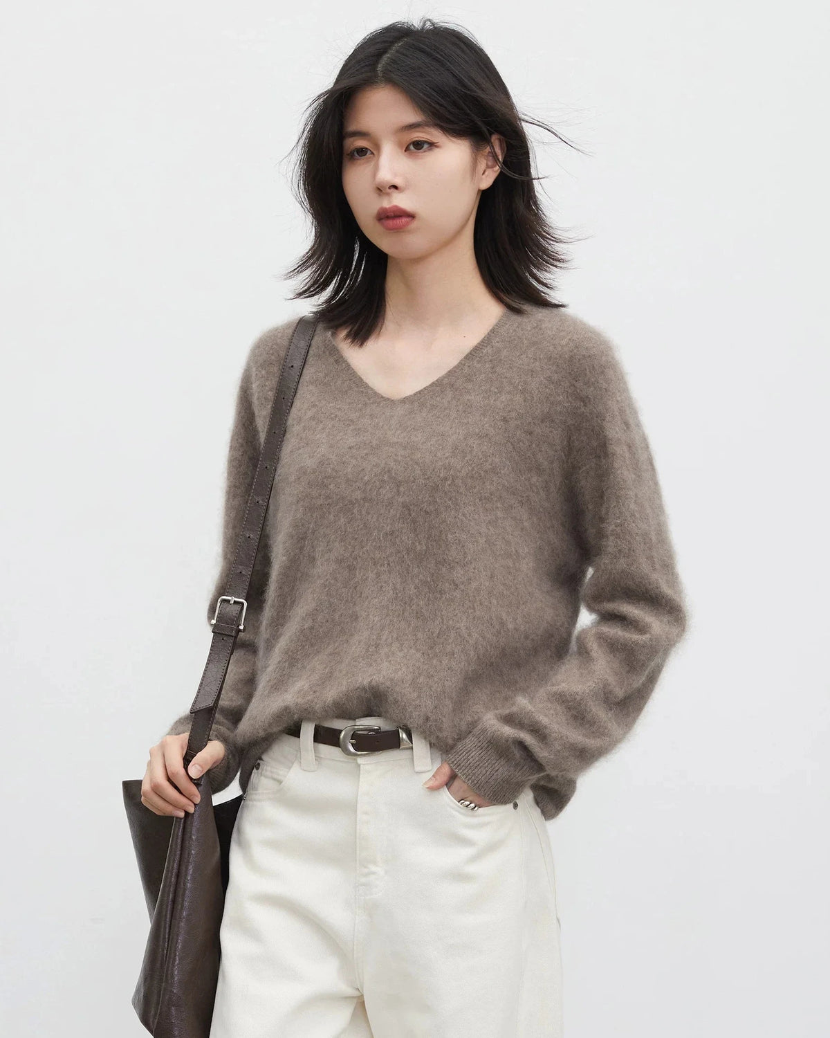 A loose wool-cashmere blend V-neck pullover with long sleeves, designed for soft breathable warmth that layers easily from office to evening.