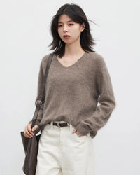 A loose wool-cashmere blend V-neck pullover with long sleeves, designed for soft breathable warmth that layers easily from office to evening.