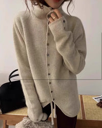 Its relaxed cut, full sleeves, and buttoned front lend a timeless shape that moves easily from home rituals to city appointments. 