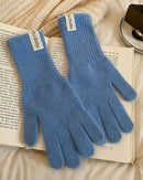 Their cable texture adds visual depth, while the fingerless design keeps movement precise for cycling, travel, or daily routines.