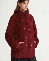 Faux fur solid stand collar single-breasted loose thick coat. Warm, vintage, and elegant — a stylish plus-size winter outerwear for women.