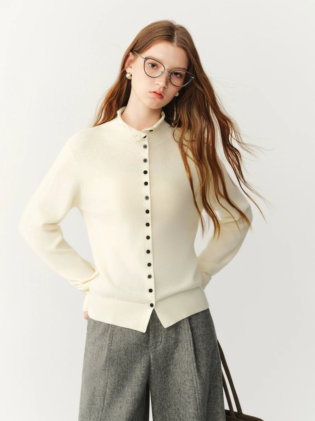 A high-neck wool button cardigan with high-neck, button front, ribbed trims, regular fit, long sleeves and stretch, designed for a cozy winter layering look that pairs from sneakers to boots.