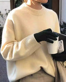 A thick cashmere crewneck sweater with crewneck, thick knit and loose fit, designed for a cozy winter layering look that pairs from sneakers to boots.