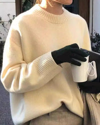 A thick cashmere crewneck sweater with crewneck, thick knit and loose fit, designed for a cozy winter layering look that pairs from sneakers to boots.