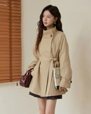 Women's stand-collar belted trench coat, featuring a structured cotton-polyester blend and self-belt for polished streetwear confidence on morning commutes or city strolls.