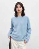 An oversized wool cashmere crew sweater with a clean round neck and loose cut, designed for soft office-ready warmth from desk to dinner.