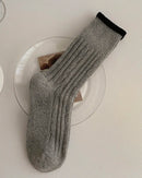 The dense knit structure cushions each step while maintaining a clean, minimal profile.