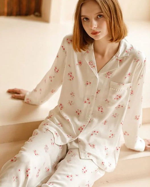 Peach Blossom printed pajama suit featuring a delicate floral pattern, a classic turndown collar, and a button-down top with a chest pocket. This two-piece sleepwear set is made from soft, thin viscose fabric and includes matching full-length pants.
