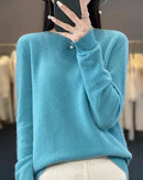 Women's Extrafine Merino wool round-neck sweater featuring a slim silhouette and 17.9-micron superfine fibre, crafted from pure Australian wool for breathable warmth and elegant layering in air-conditioned indoor settings.
