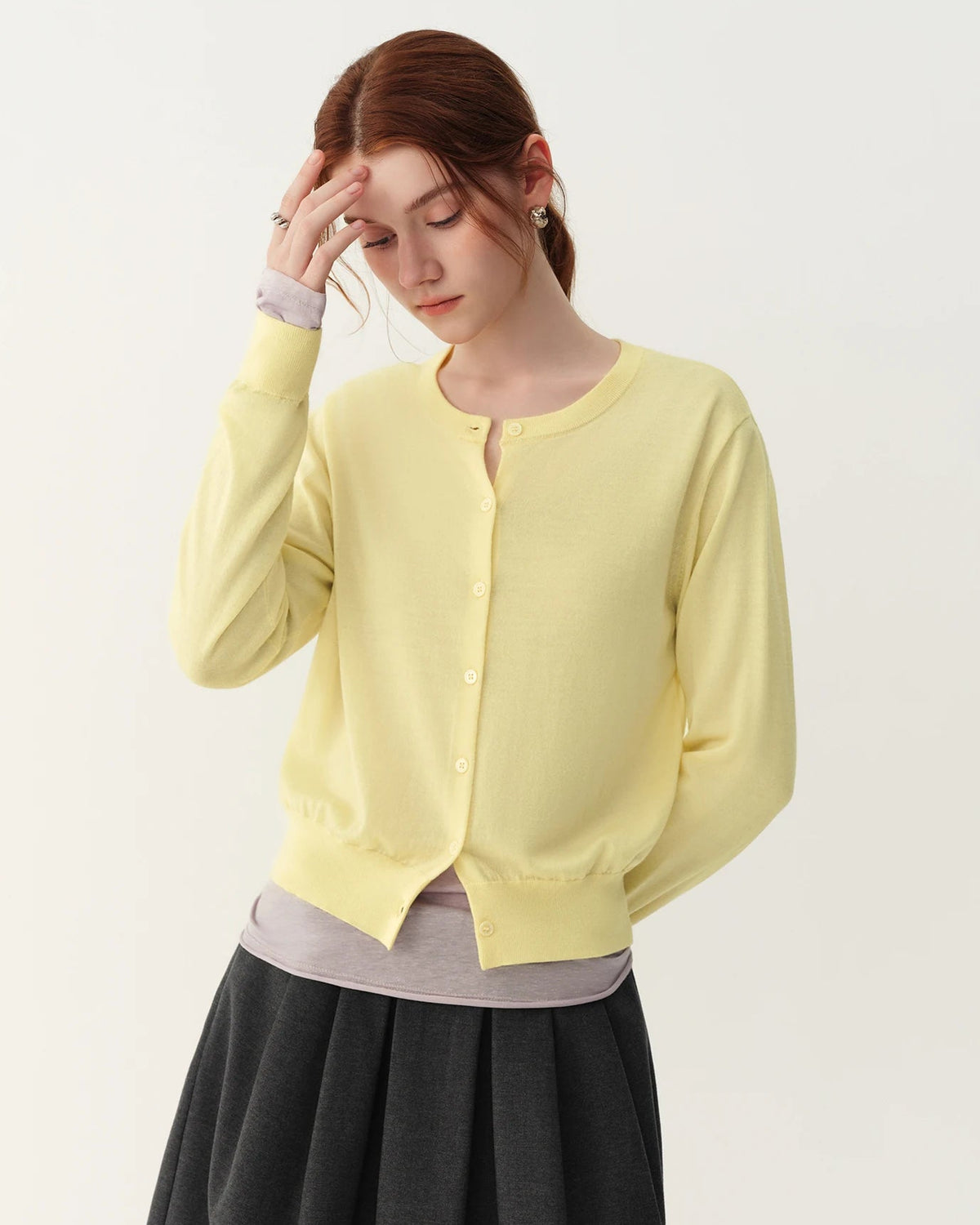 A rib-trim wool crewneck cardigan with crewneck, button front, ribbed trims, regular fit, long sleeves and stretch, designed for a cozy winter layering look that pairs from sneakers to boots.