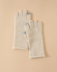 Baby cashmere knit gloves — featherlight, touchscreen-ready, and wrist-length. Available in six refined tones.