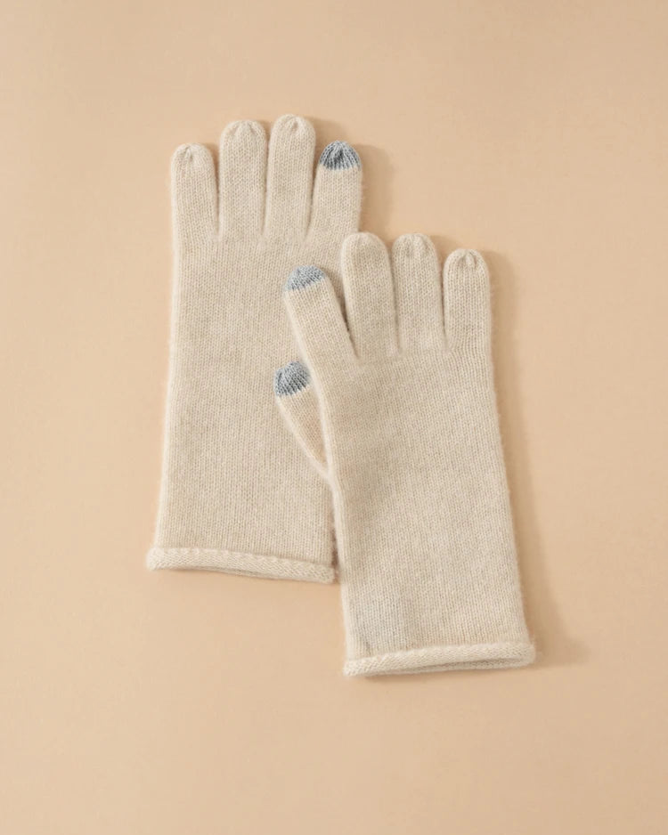 Baby cashmere knit gloves — featherlight, touchscreen-ready, and wrist-length. Available in six refined tones.