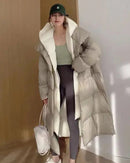 Layered-look hooded cotton-padded coat with contrasting inner detail, generous hood, long quilted shape and pockets, a warm fall-winter coat for commutes or relaxed winter plans.