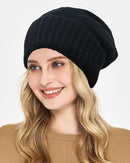 Satin-lined cashmere beanie with wide ribbed turn-up cuff, relaxed slouchy crown and smooth satin interior, a warm solid fall-winter knit hat for commuting or weekend walks.