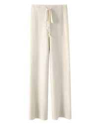 A pair of high-waist knit wide-leg pants featuring an adjustable tie belt, side pockets, and a floor-length straight drape for an elegant look.