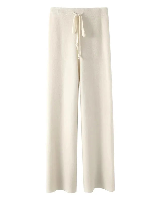 A pair of high-waist knit wide-leg pants featuring an adjustable tie belt, side pockets, and a floor-length straight drape for an elegant look.