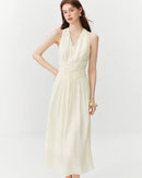 Women's Halterneck V-neck twist midi dress crafted from fluid viscose blend fabric, featuring an empire waist and A-line silhouette for French vacation elegance and summer comfort.