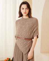 Cable-knit cashmere poncho for women with openwork cable pattern, ribbed crewneck and ribbed hem edging, a loose fall-winter poncho for daytime or understated evening looks.