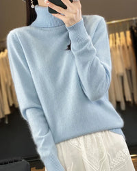 A mink cashmere turtleneck sweater with turtleneck, regular fit, long sleeves and slight stretch, designed for a cozy winter layering look that pairs from sneakers to boots.