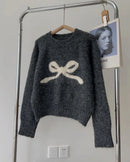 The smooth knit, full sleeves, and close silhouette create a refined foundation without excess volume.