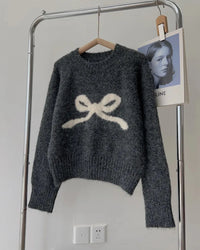 The smooth knit, full sleeves, and close silhouette create a refined foundation without excess volume.