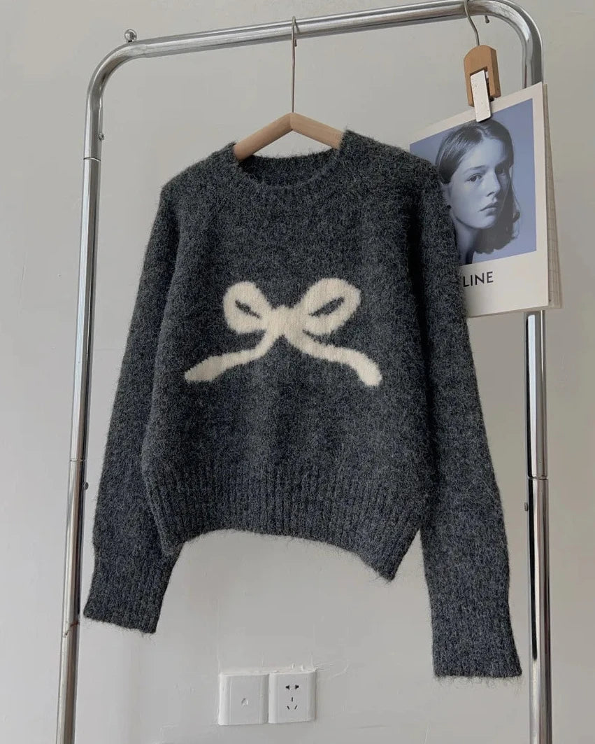 The smooth knit, full sleeves, and close silhouette create a refined foundation without excess volume.
