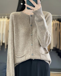 A cotton blend knit offers a gently textured hand, complemented by long sleeves and a regular fit that feels easy to wear.