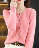 A pure mink cashmere round neck cardigan with a button front and loose knit-coat cut, designed for thick quiet warmth that layers easily over tees.