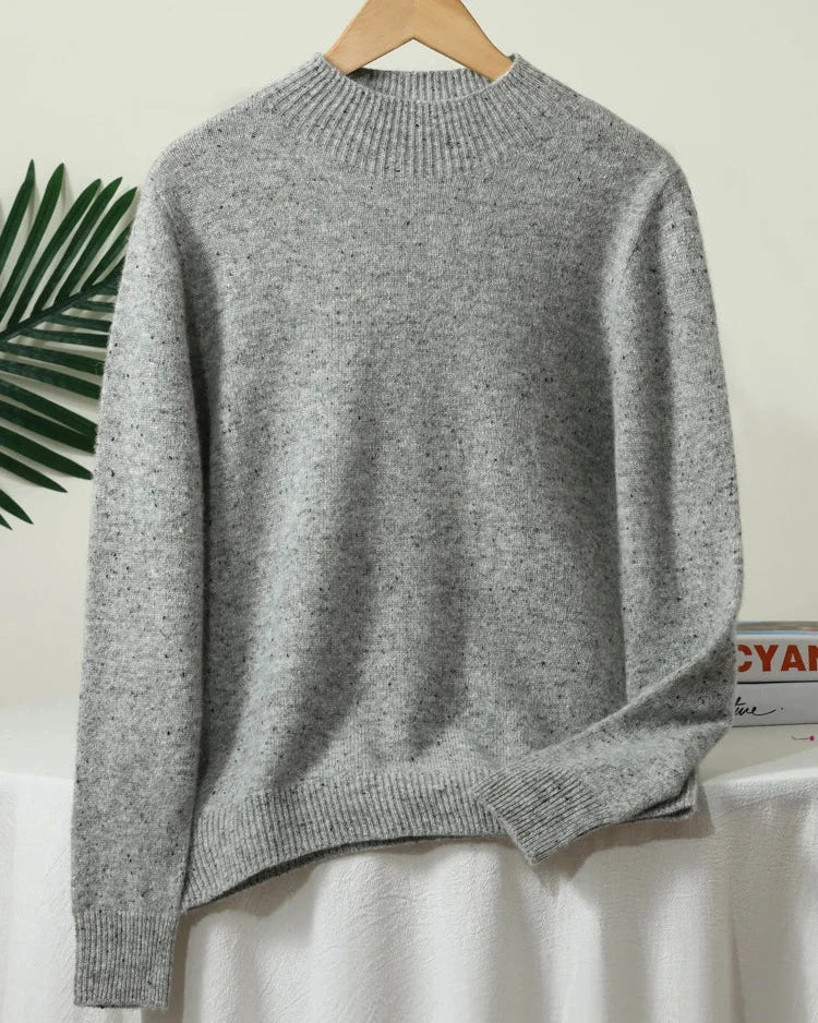 A thick 100% Australian extrafine merino wool sweater with a mock neck and full sleeves, designed for soft anti-pilling warmth that layers easily.