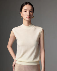 Lightweight worsted wool mock neck sleeveless vest. Machine washable, regular fit, slight stretch.